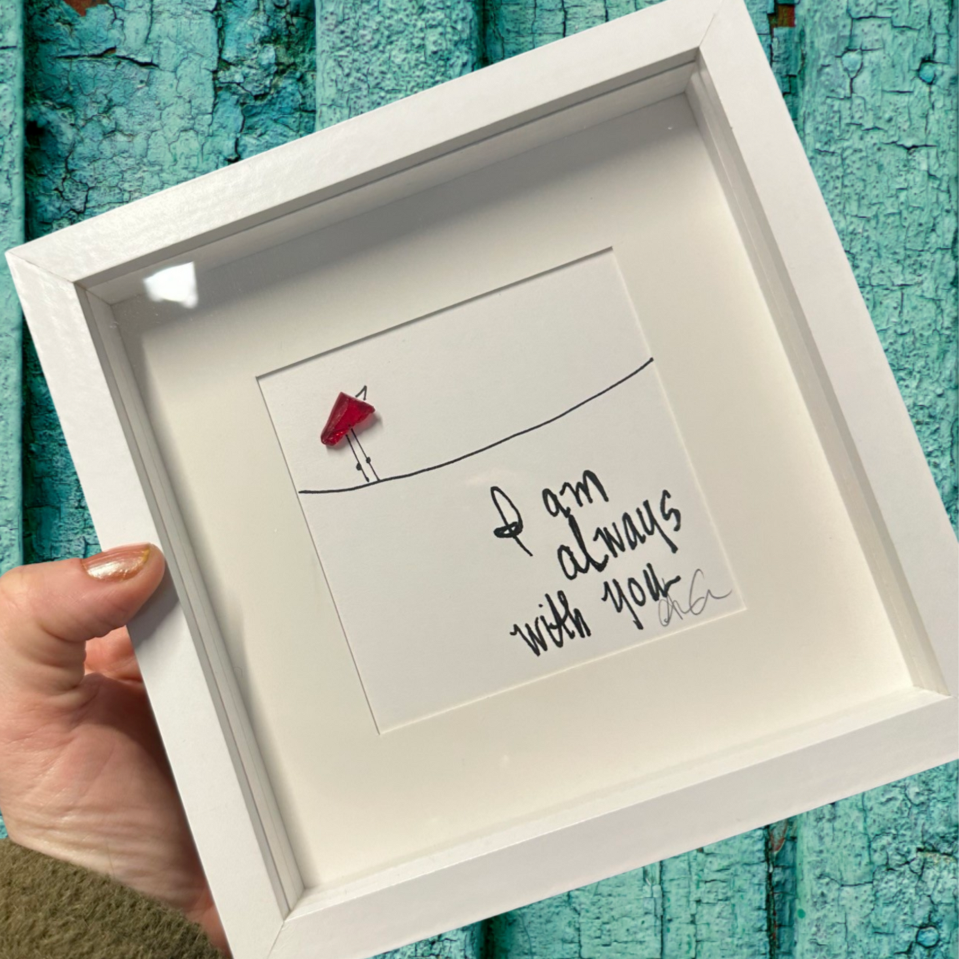 Framed artwork with a red bird and text 'I'm am always with you' sea glass art