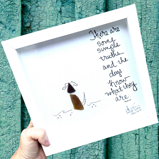There are some simple truths and the dogs know what they are sea glass dog sitting on shoreline