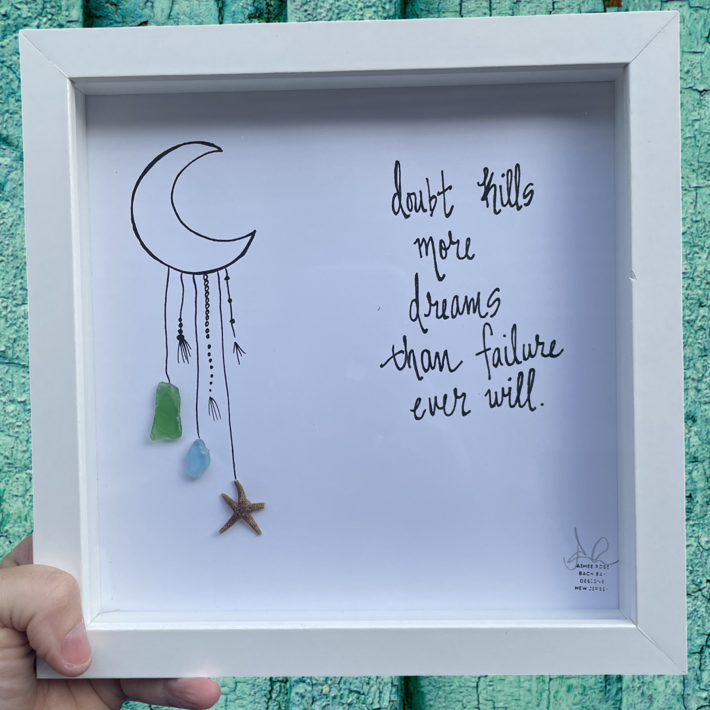 Framed artwork with a dreamcatcher illustration and motivational quote doubt kills more dreams than failure sea glass art