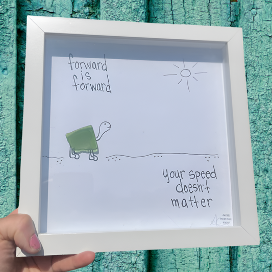 Framed artwork with a turtle illustration forward is forward your speed doesnt matter sea glass art by back bay designs