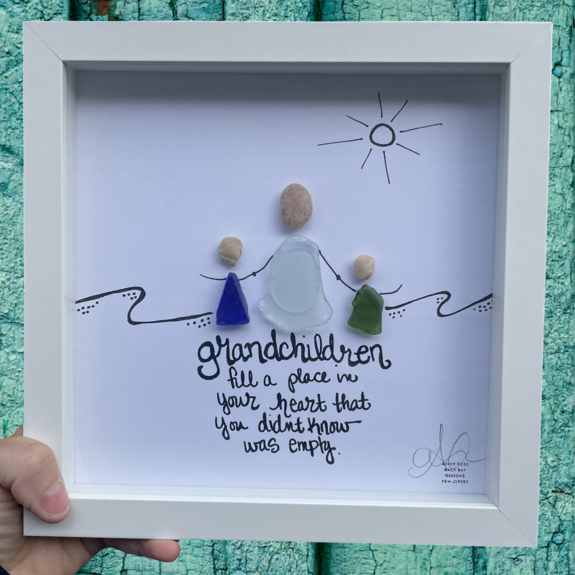 Framed artwork with pebbles and sea glass on a white background, grandchildren fill a place in your heart that you didnt know was empty sea glass art gifts for grandchild and gifts for grandparent
