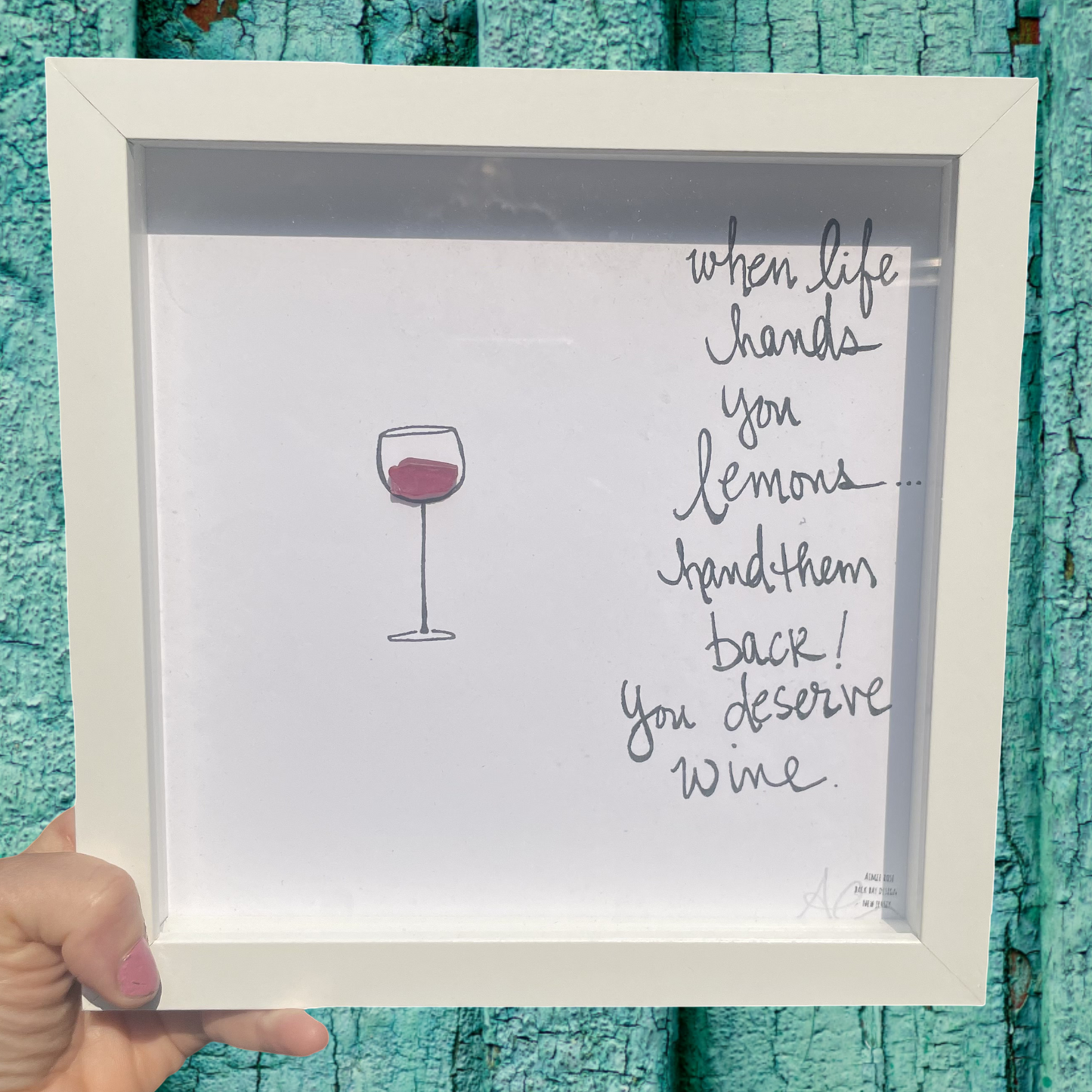 Framed print with a wine glass illustration and humorous quote when life hands you lemons hand them back! you deserve wine.