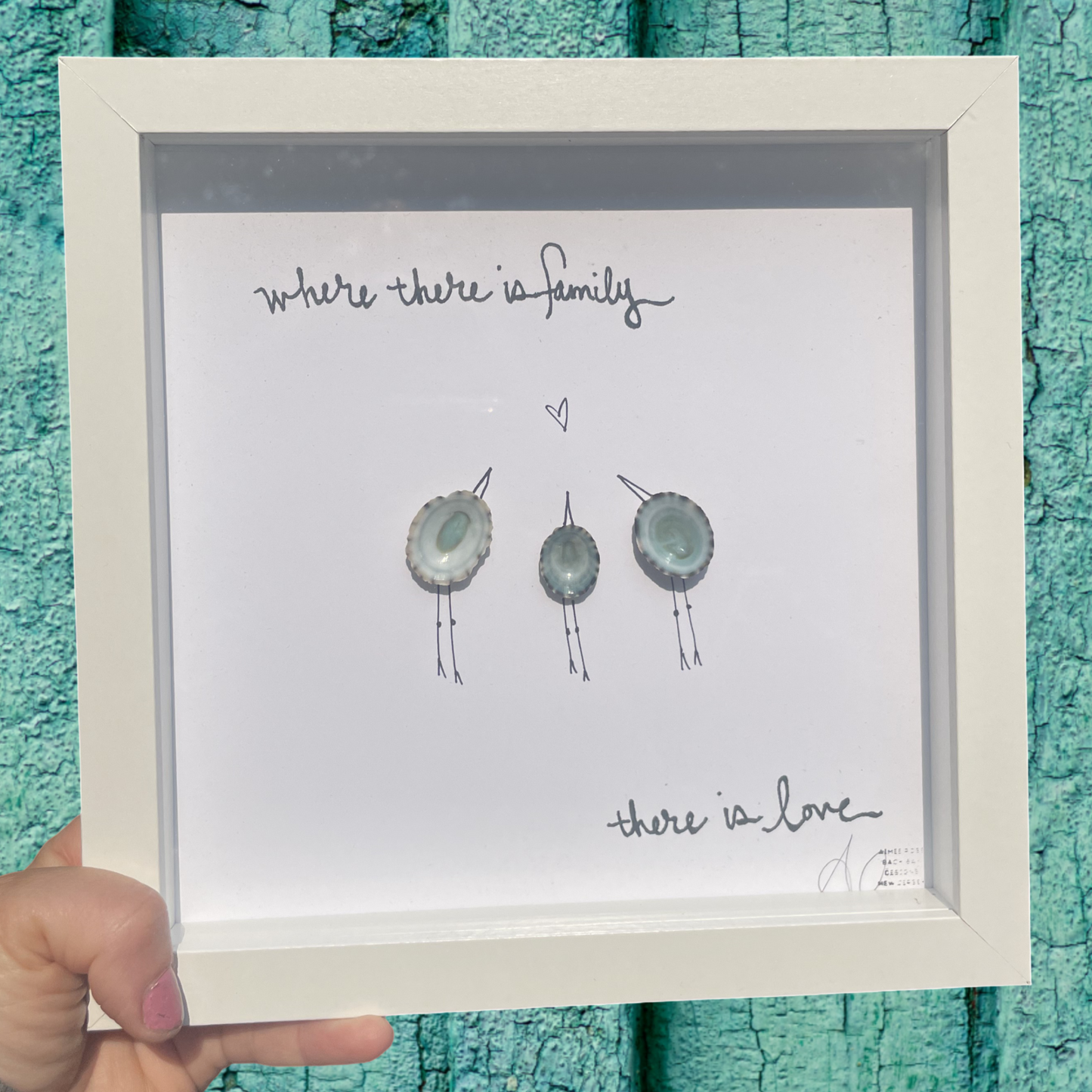 Framed artwork with text 'Where there is family, there is love' limpet shells customizable art
