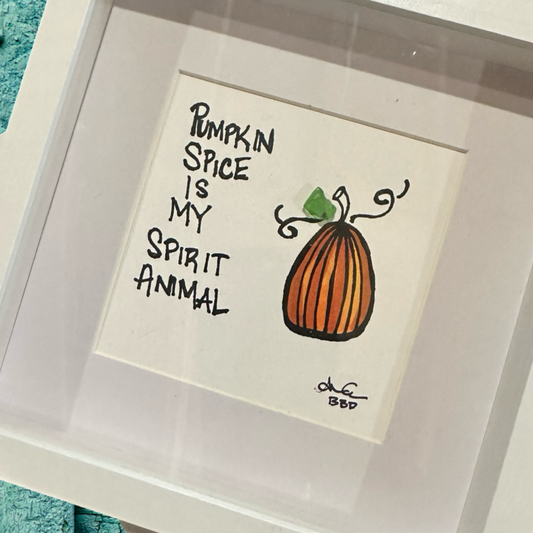 Framed artwork with 'Pumpkin Spice is my Spirit Animal' text and pumpkin illustration. sea glass art