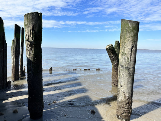 Two pilings gateway to open blue sky 