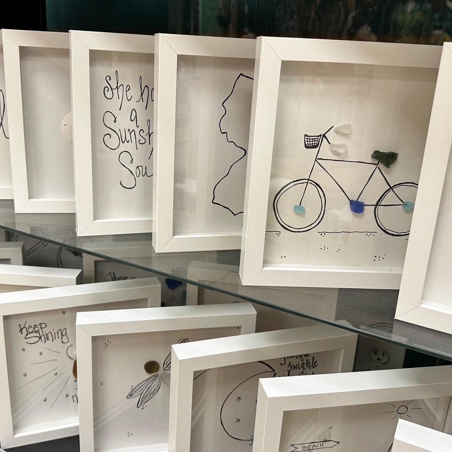  Sea Glass Art by BBD BBD Display_8x8_standing_up_on_2_glass_shelves_bicycle_sea_glass_art