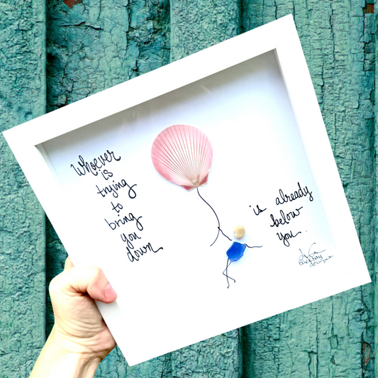 "Whoever is trying to bring you down is already elow you" Seashell balloon with sea glass person holding onto string