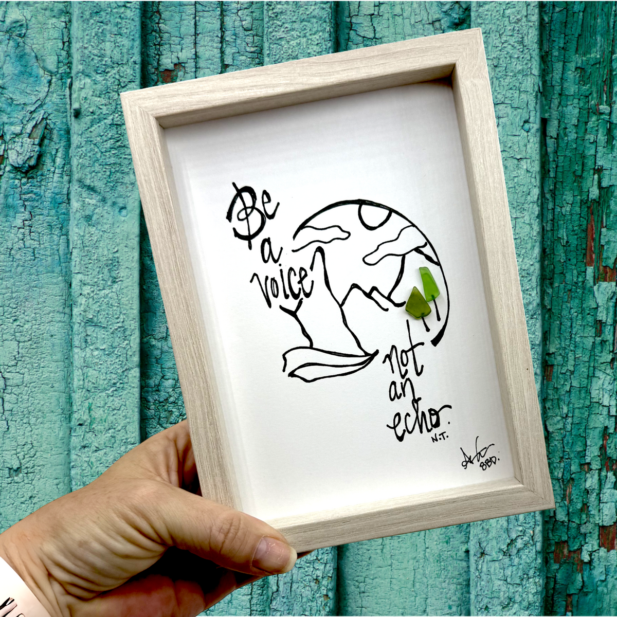 Quote: "Be a voice not an echo. -N.T." Image: Hand-drawn arch with mountains and clouds, with two sea glass trees