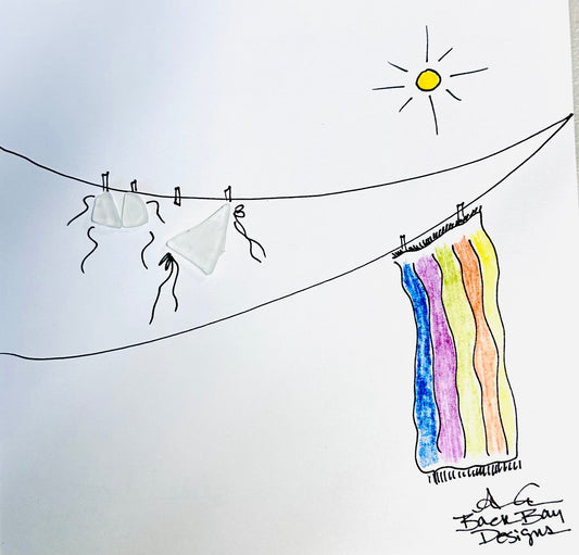 Colorful towel hanging on a clothesline with a sun in the background, labeled 'A Be Back Bay Designs'.