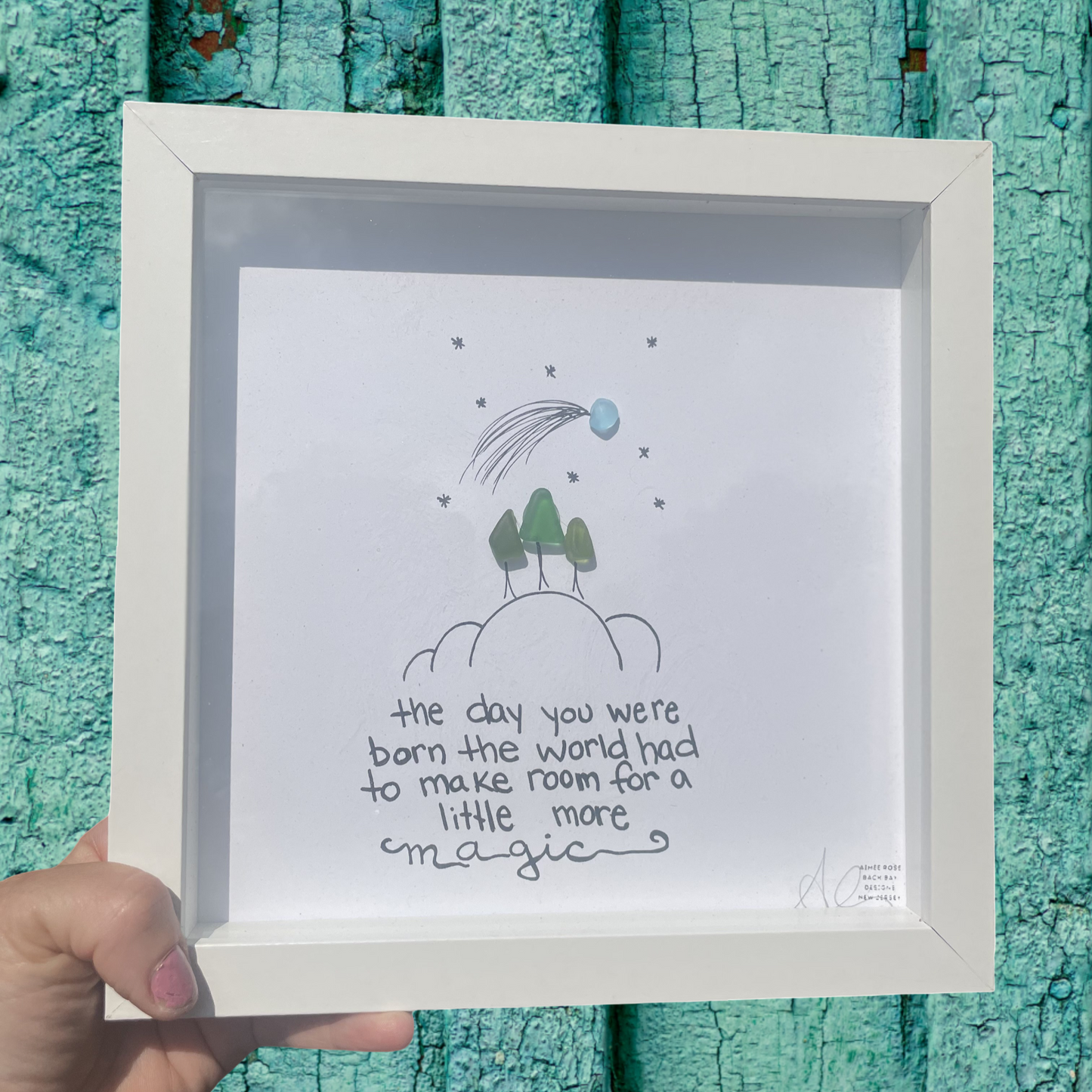 Framed artwork with a quote and illustration the day you were born the world had to make room for a little more magic sea glass art 