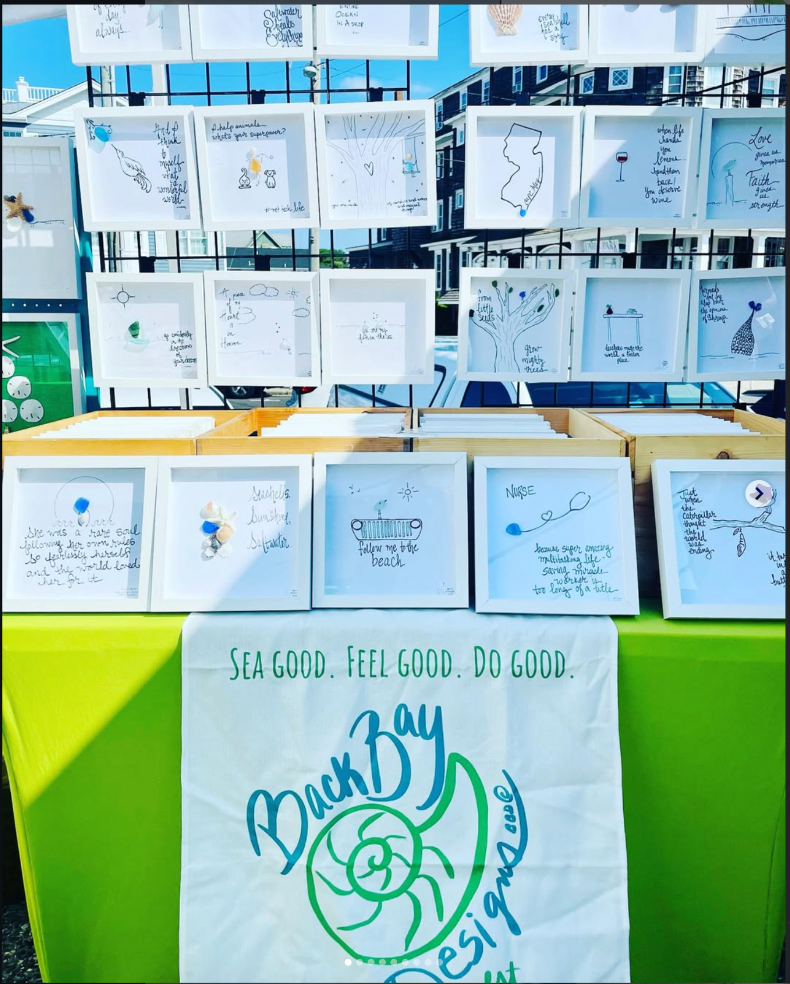 Display Outdoor Assorted 8x8 sea glass art in sun outdoor art show with banner bright green 