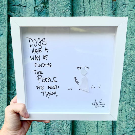 "Dogs have a way of finding the people who need them." Sea glass dog sitting on the beach 