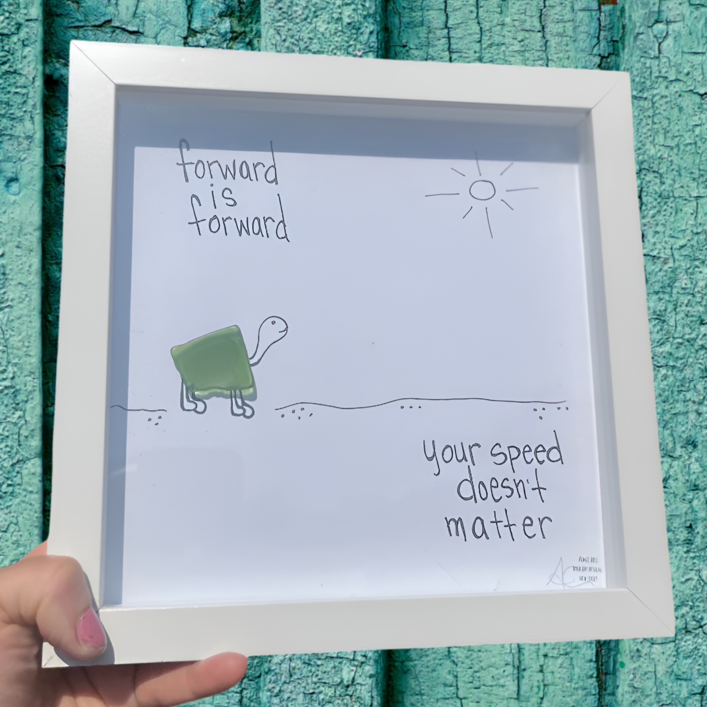 Framed artwork with a turtle illustration forward is forward your speed doesnt matter sea glass art by back bay designs