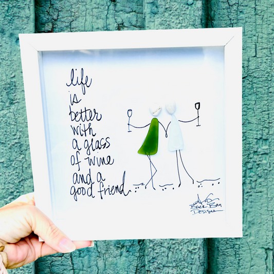 Life is better with a glass of wine and a good friend - two people holding hands and a glass of sea glass wine 