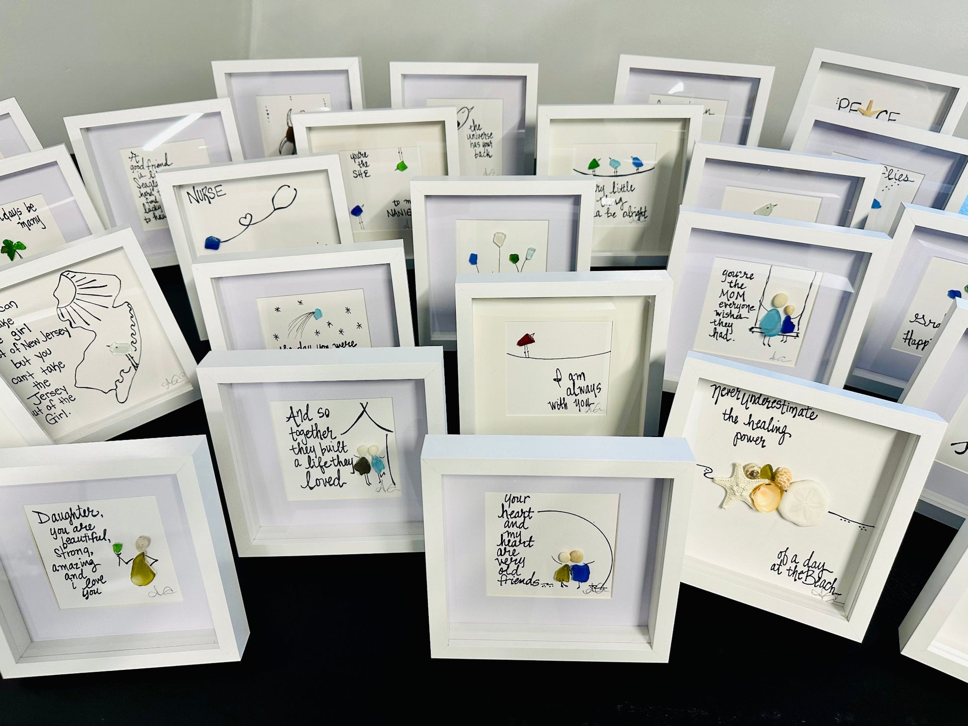 Group of MINI frames white wall on black table 