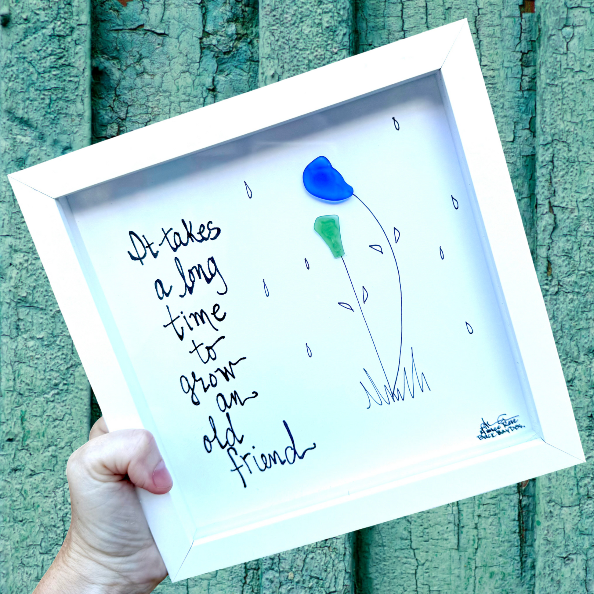 It takes a long time to grow and old friend - two sea glass flowers 