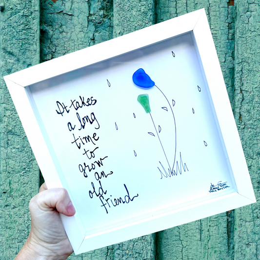 It takes a long time to grow and old friend - two sea glass flowers 