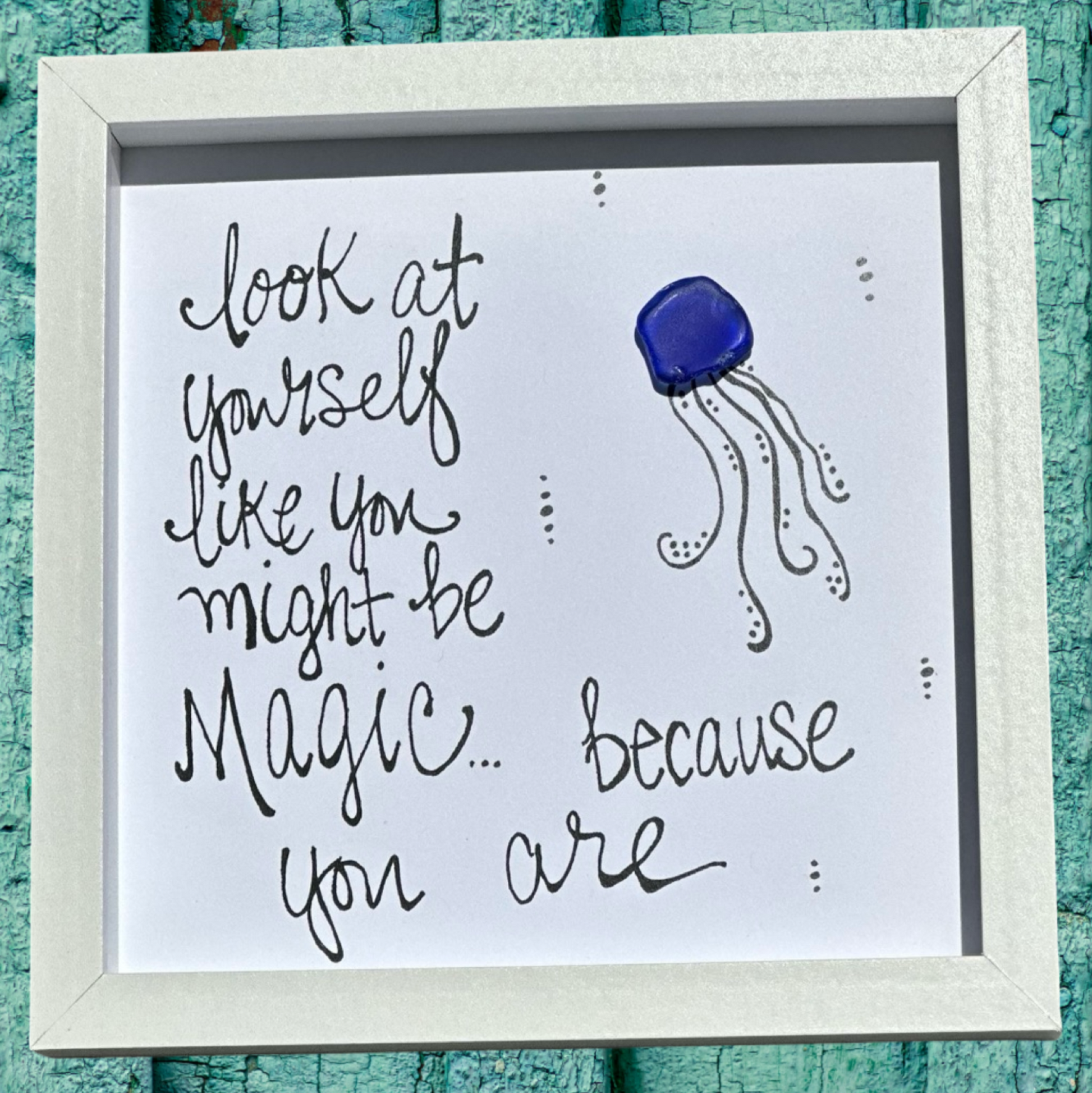 Framed artwork with a jellyfish illustration and motivational quote look at yourself like you might be magic... because you are. sea glass art 