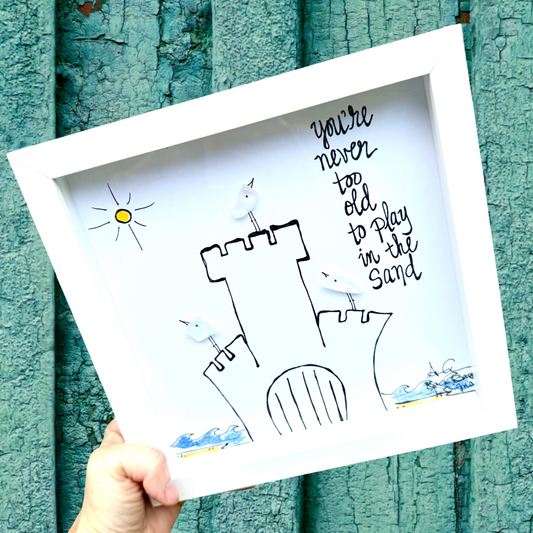 "you're never too old to play in the sand." sandcastle with sea glass birds, waves and sun 8 inch 