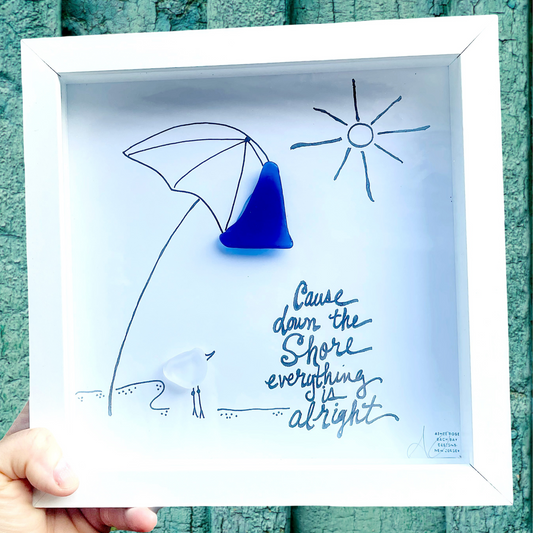 Framed artwork with a seaglass piece and beach-themed drawingcause down the shore everything is alright sea glass art 