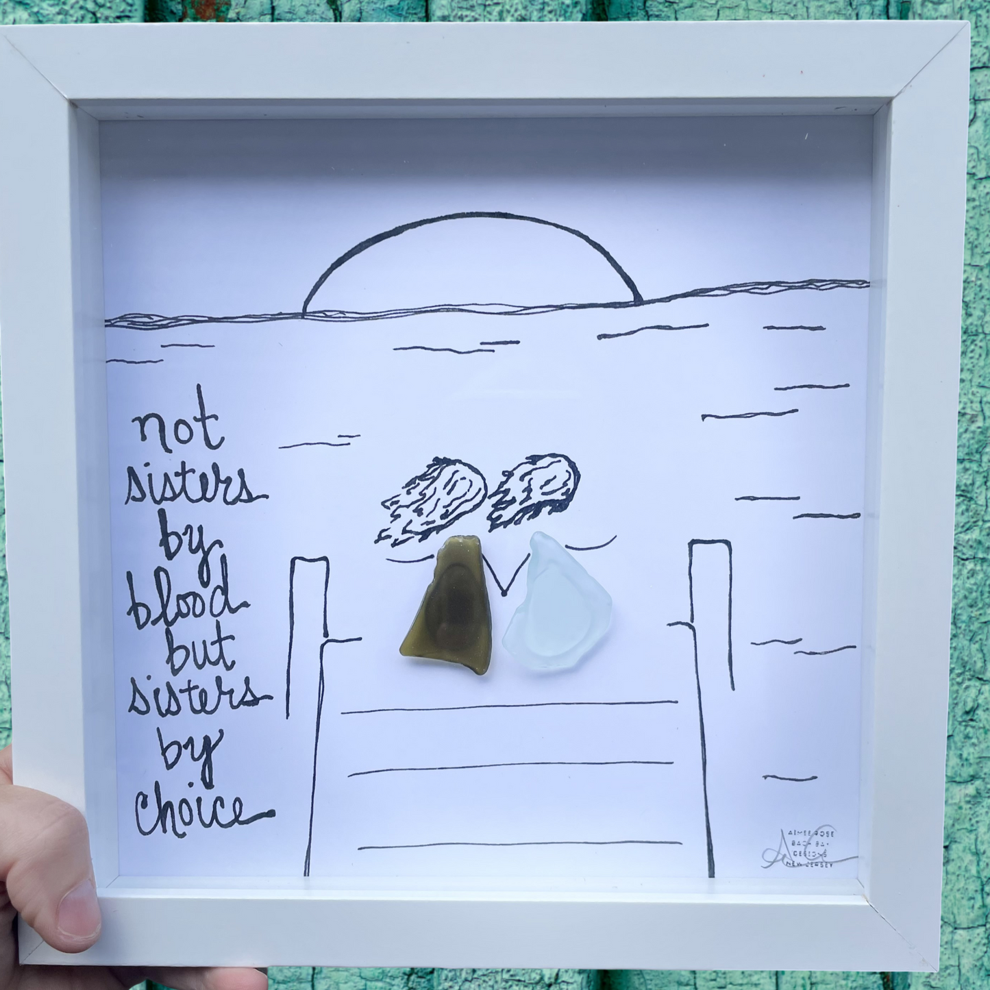 Framed artwork with a beach scene and two sea glass art not sisters by blood but sisters by choice 