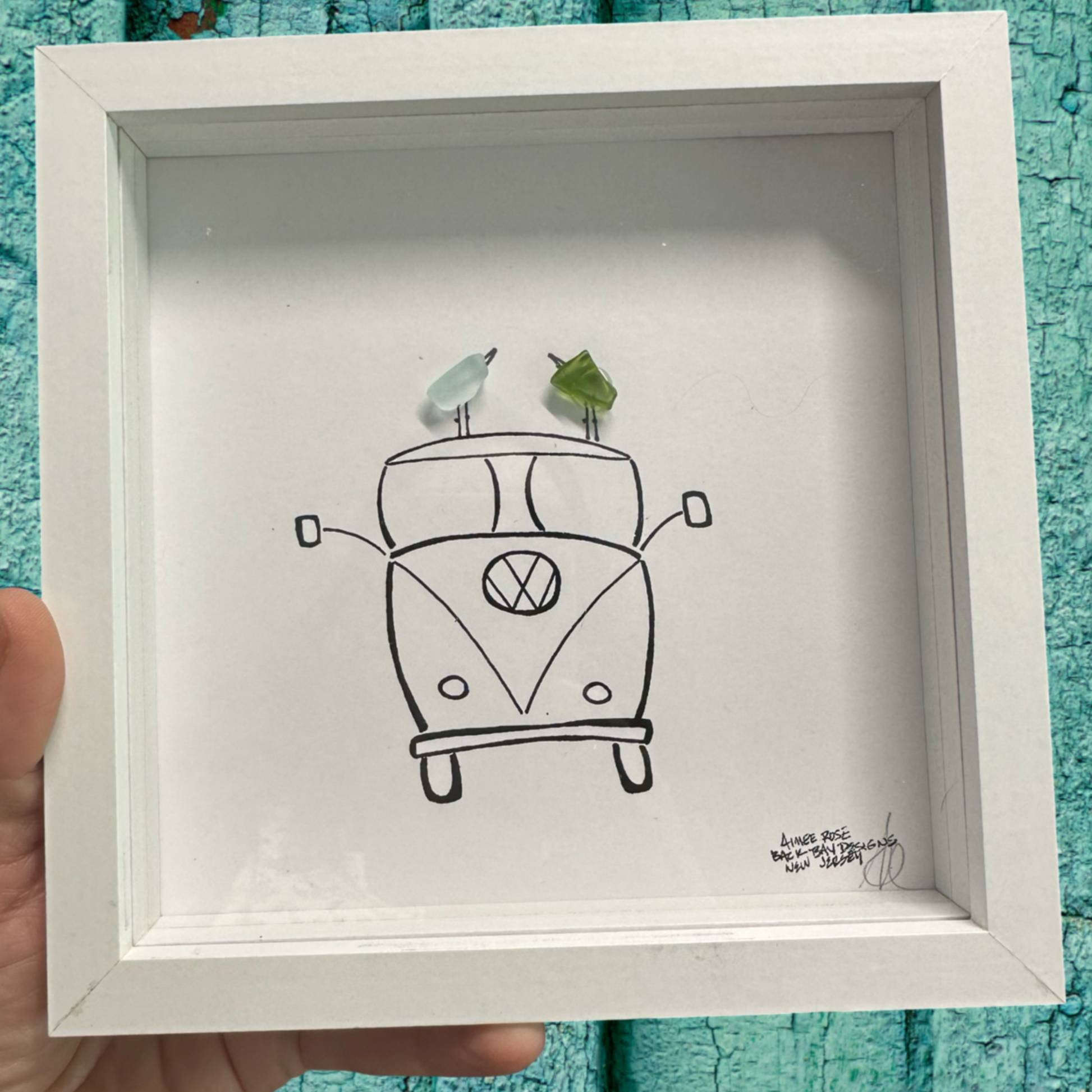 Framed drawing of a Volkswagen van with two birds on top sea glass art 
