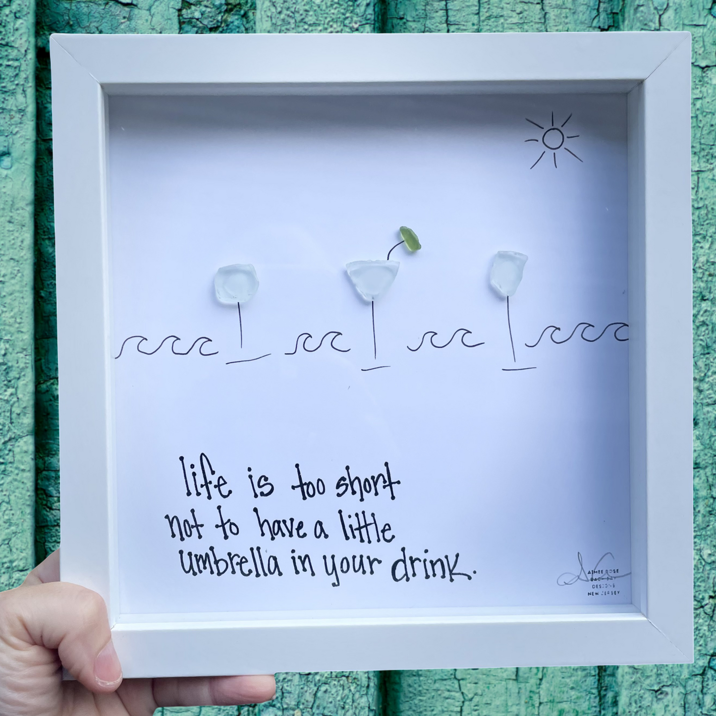 Framed artwork with text life is too short not to have a little umbrella in your drink. sea glass art 