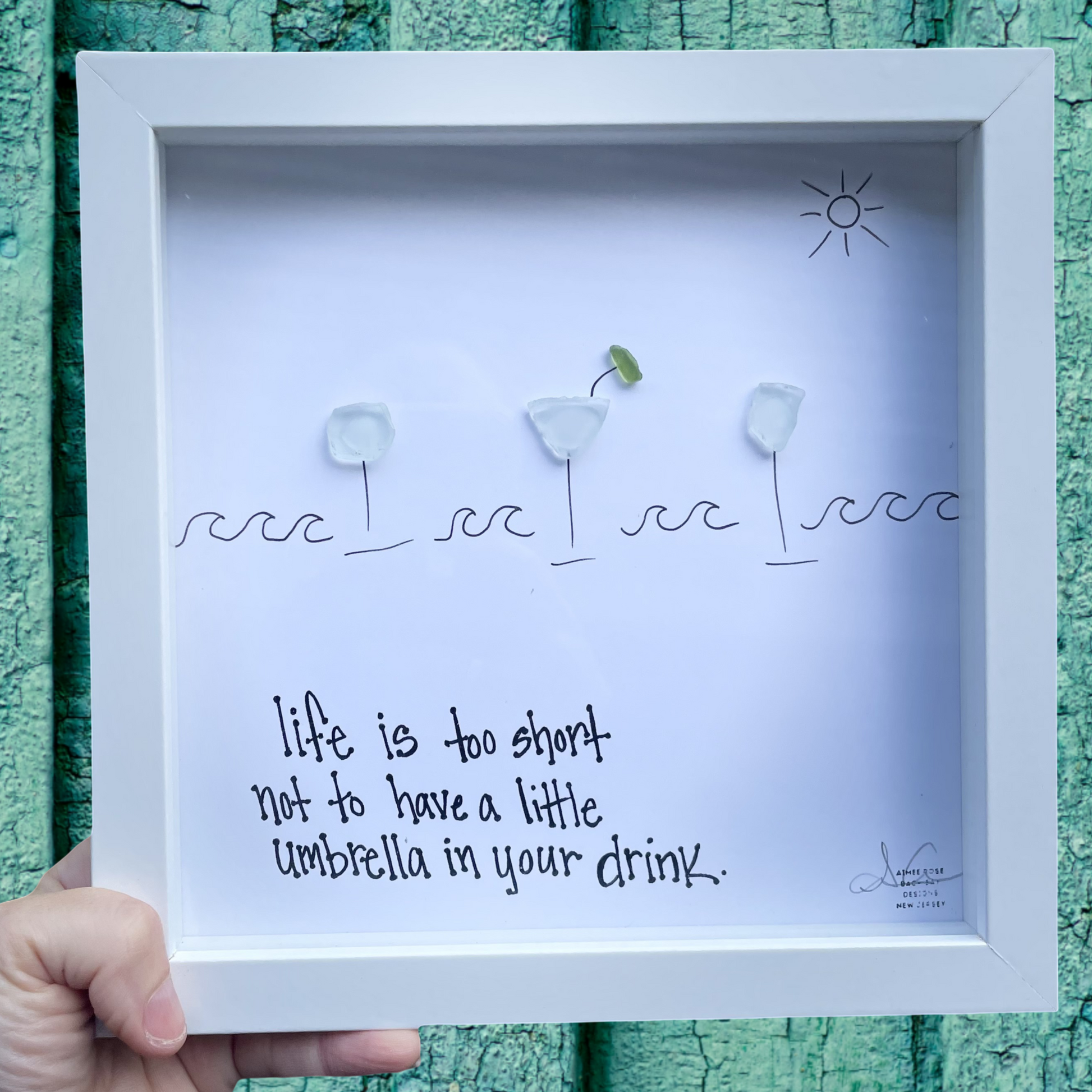 Framed artwork with text life is too short not to have a little umbrella in your drink. sea glass art 