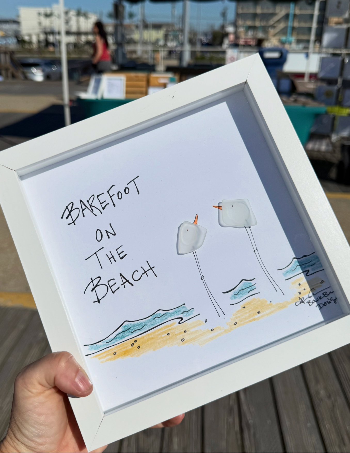 barefoot_on_the_beach_hand_held_on_boardwalk