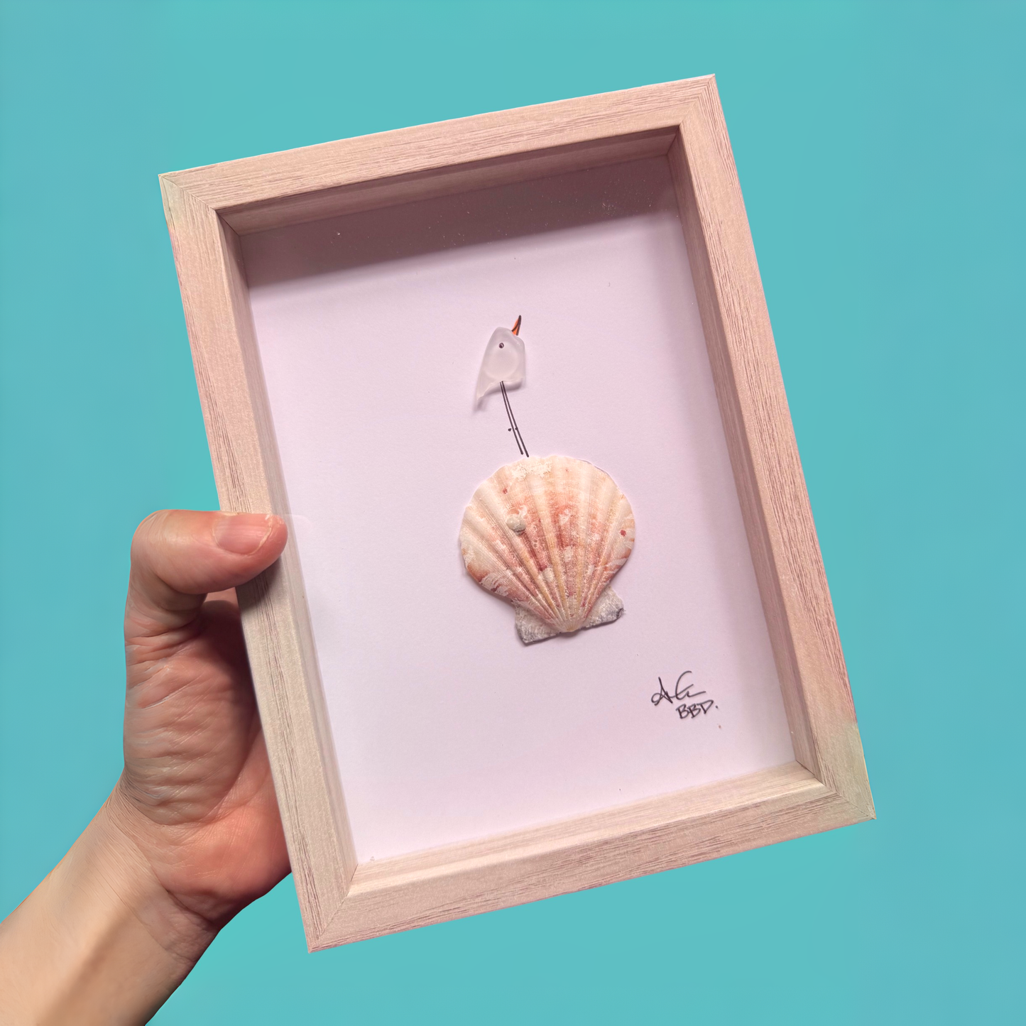 Image only, no words Hand drawn Sea glass sea bird looking upward perched on scallop shell