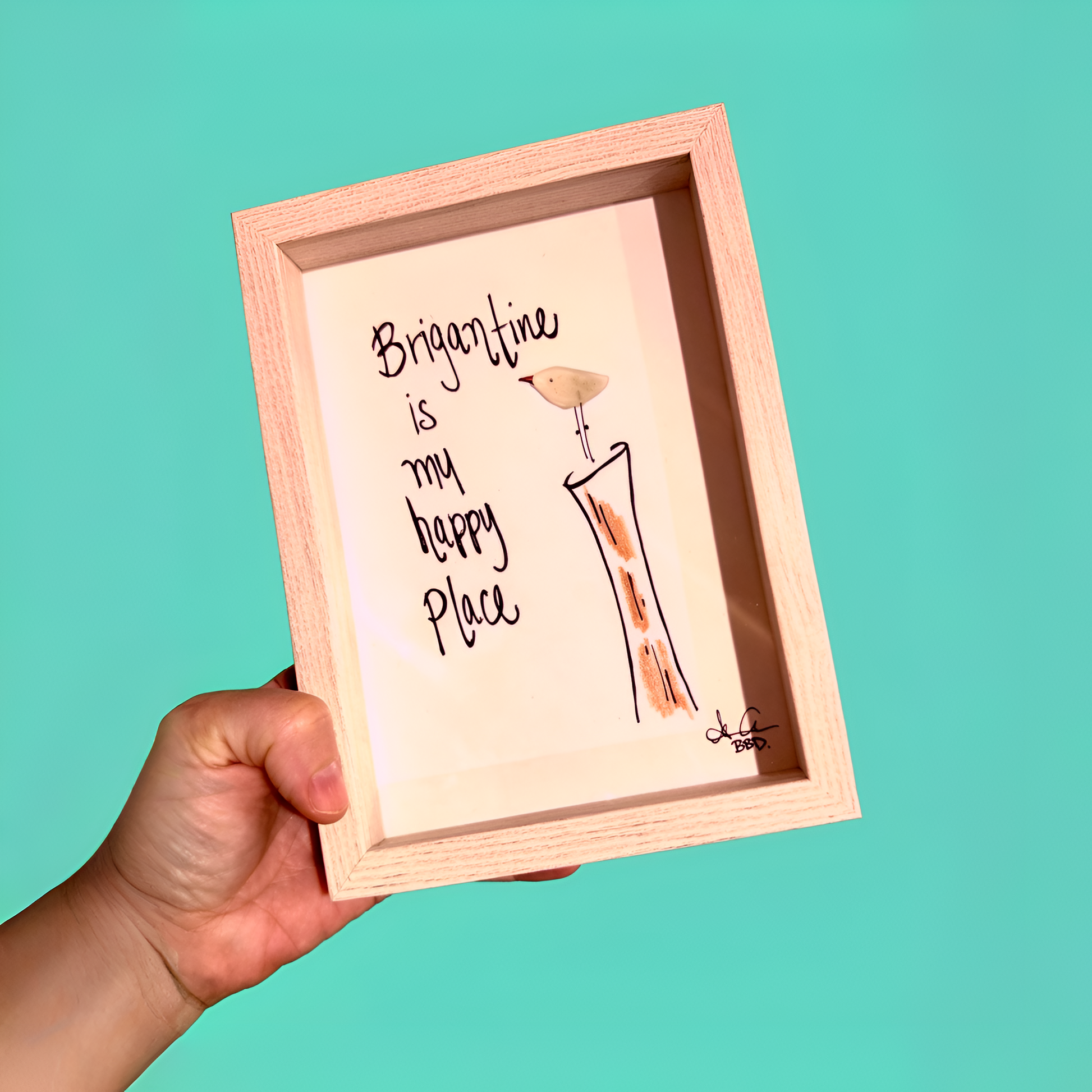 brigantine_is_my_happy_place_upscale_teal_handheld "Brigantine is my happy place." Sea glass sea bird perched on hand drawn piling 
