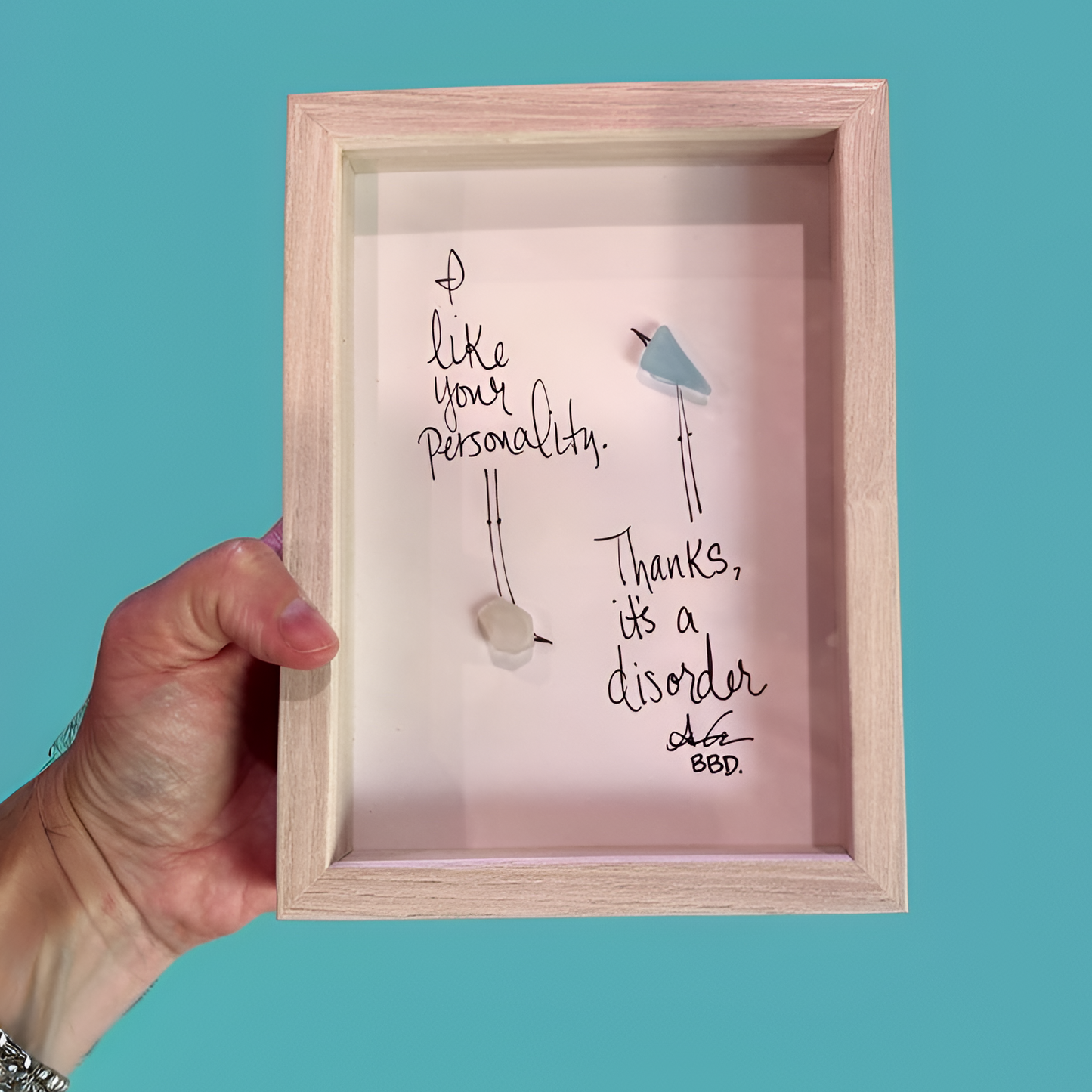 disorder_2_upscale close "I like your personality. Thanks, it's a disorder." two sea glass birds with hand drawn legs. One flipped upside down looking at one right side up