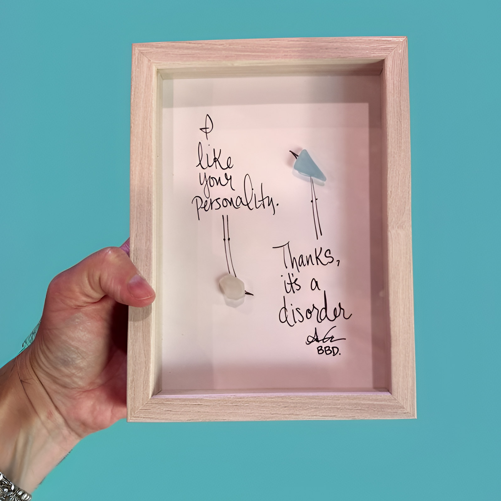 disorder_2_upscale close "I like your personality. Thanks, it's a disorder." two sea glass birds with hand drawn legs. One flipped upside down looking at one right side up