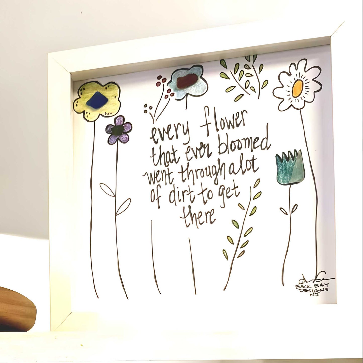 every flower bloomed through dirt 8in sea glass art shelf on white 