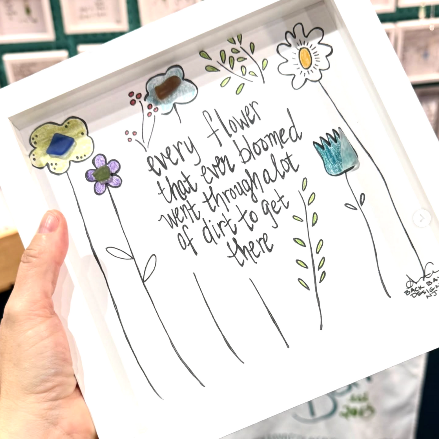 flower bloom through dirt 8in sea glass art 