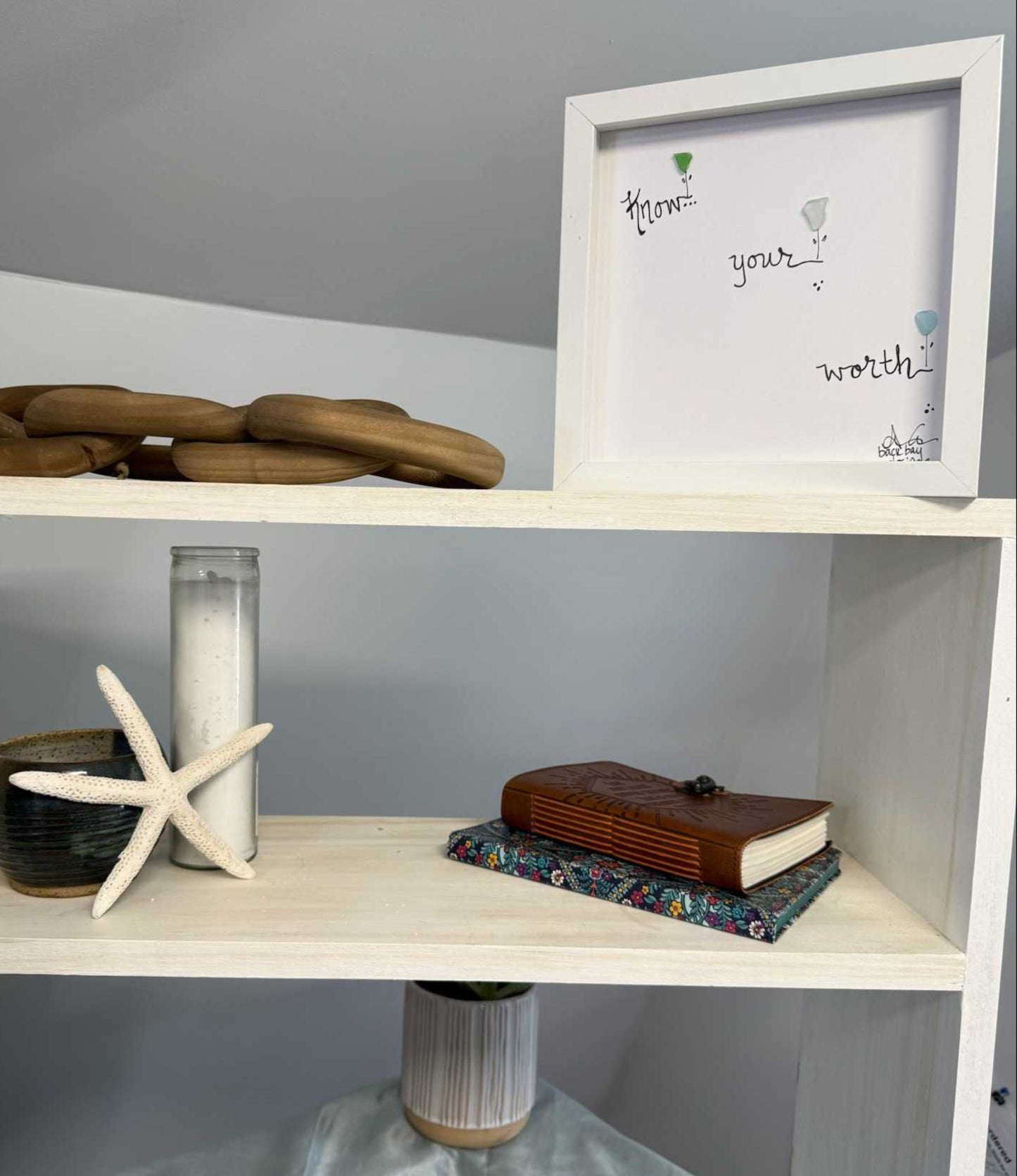 know your worth 8in sea glass at on shelf with candle 