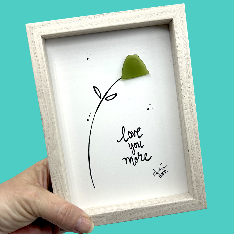 Quote: "love you more" Image: Sea glass flower on a long hand-drawn stem with two leaves and scattered dots