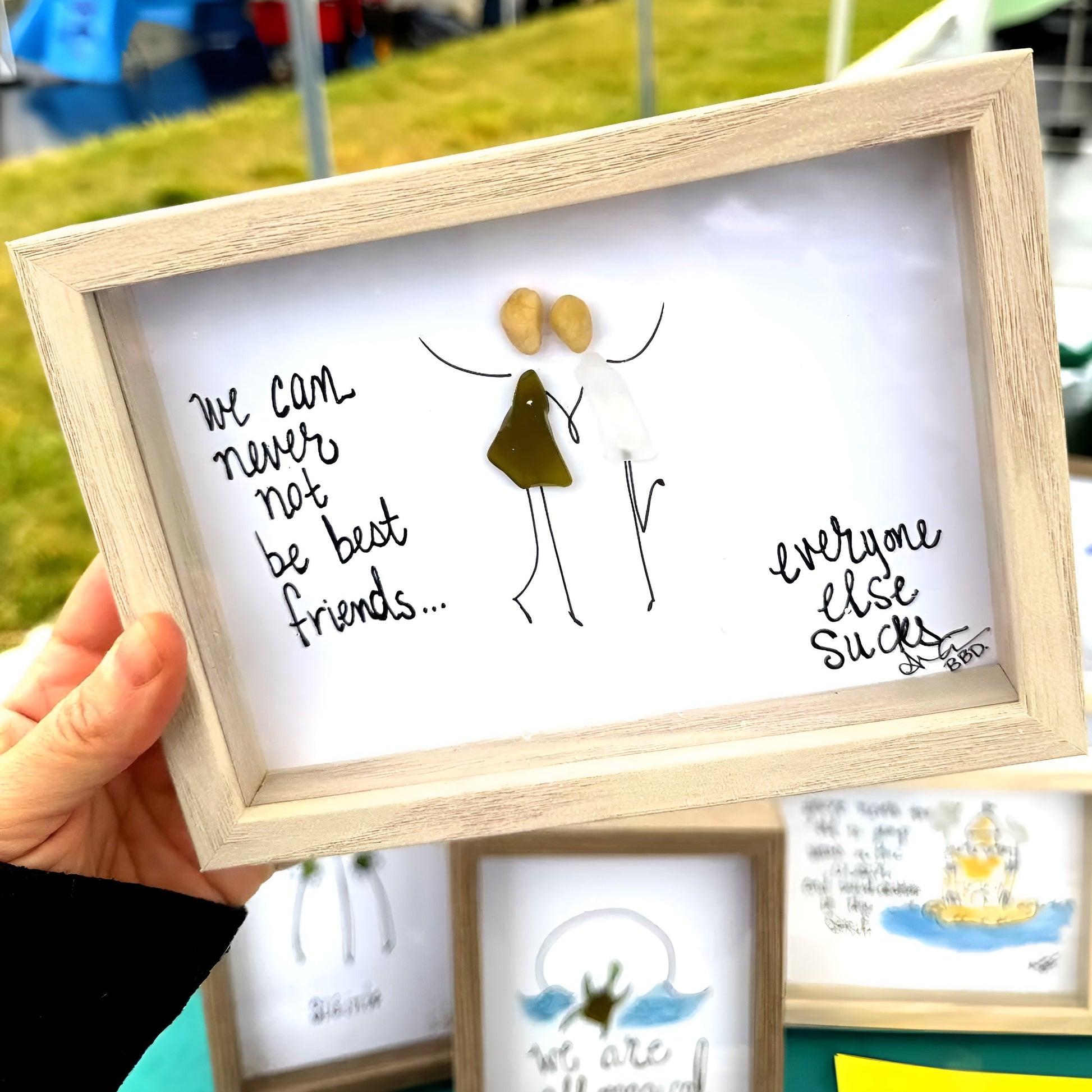 "We can never not be best friends...everyone else sucks." 2 seaglass people with hand drawn hands in entwined and upstretched arms, one kicking up a heel in joy