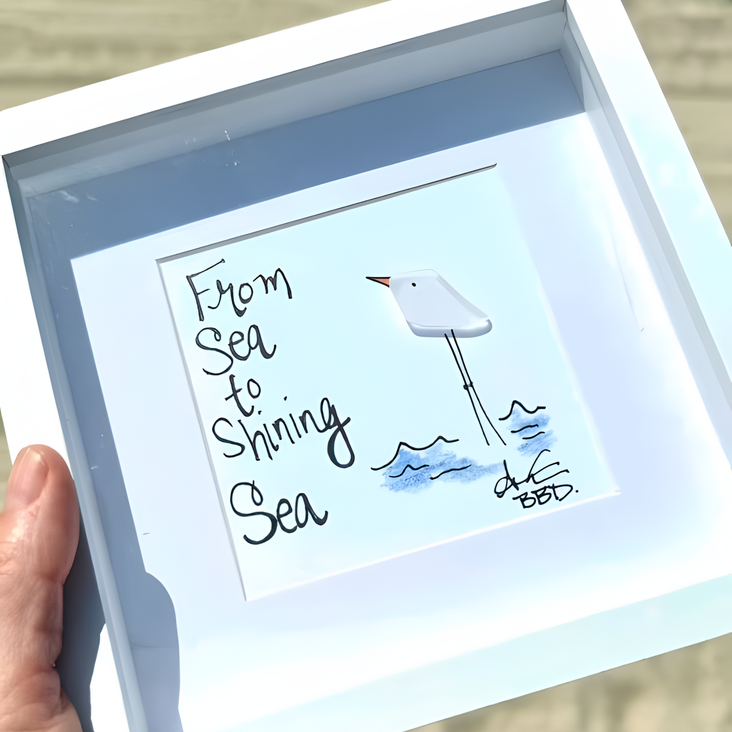 sea_to_shining_sea_handheld_on_beach_6in_upscale_square 